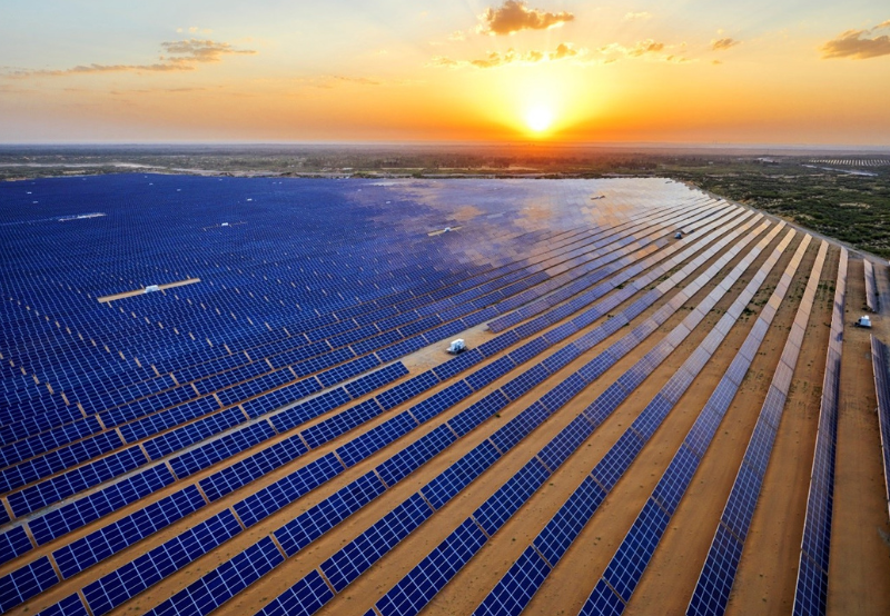 MSKVY 2.0 Expansive solar park under clear skies showcasing rows of solar panels generating renewable energy in India.